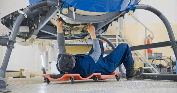 istock Mechanic repairing helicopter engine 1433312543