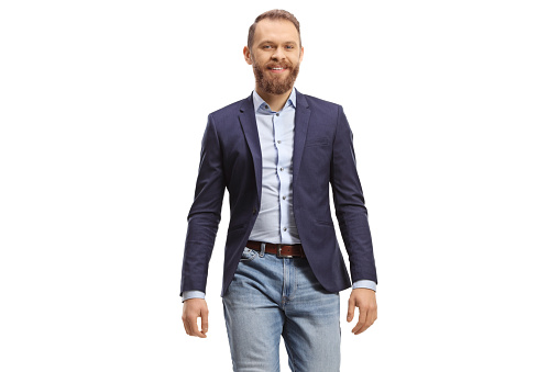 Man in formal casual clothes walking towards camera and smiling isolated on white background