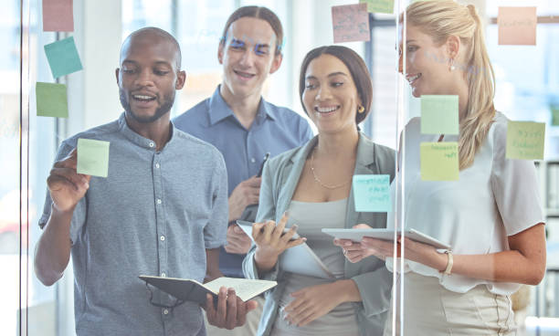 istock Post it, writing or teamwork vision for target audience strategy in business meeting, training or innovation coaching. Creative motivation, diversity people planning startup marketing on sticky notes 1433315958
