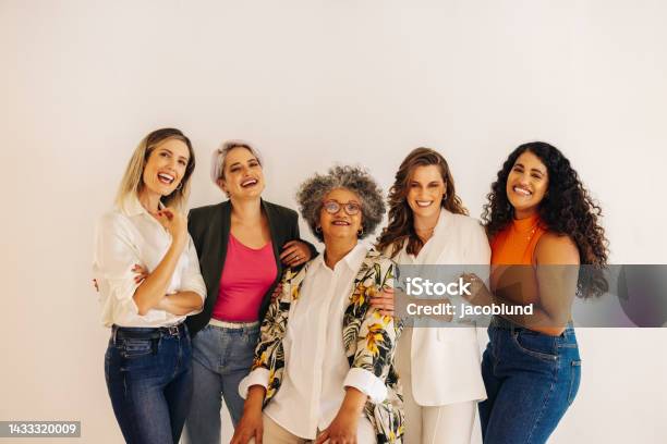 Diverse Businesswomen Smiling At The Camera In An Office Stock Photo - Download Image Now