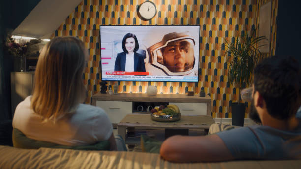 istock Couple watching news about space mission 1433320561