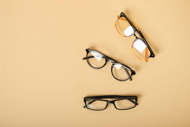 istock several pairs of glasses on a beige background 1433322649