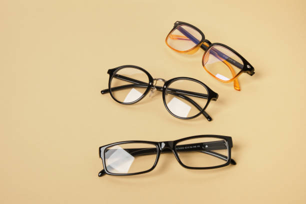 istock several pairs of glasses on a beige background 1433322654