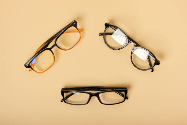 istock several pairs of glasses on a beige background 1433322657