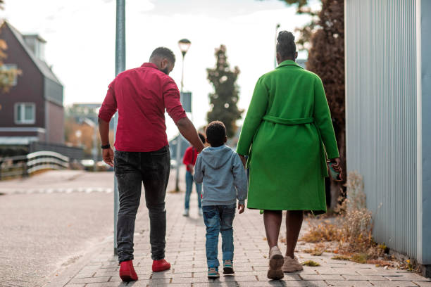 istock Beautiful Family enjoying a walk together 1433323656