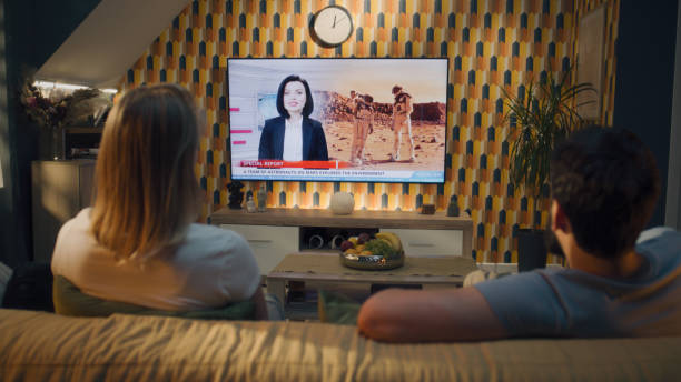 istock Couple watching news about space mission 1433324131