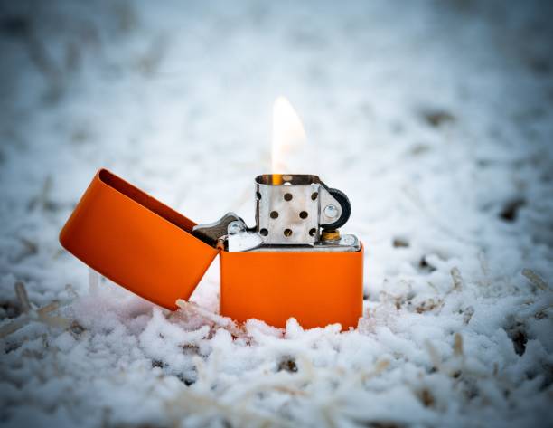 istock Closeup shot of an orange lit cigarette lighter 1433324235