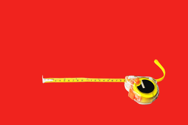 Measurement tape on red background