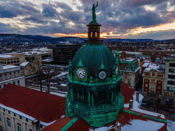 Aerial shot of a green temple in downtown Binghamton, during an orange sunset An aerial shot of a green temple in downtown Binghamton, during an orange sunset binghamton ny stock pictures, royalty-free photos & images