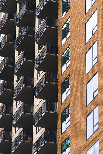 A vertical shot of a modern residential building with balconies in Minneapolis, Minnesota