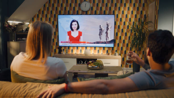 istock Couple watching news about space mission 1433326358