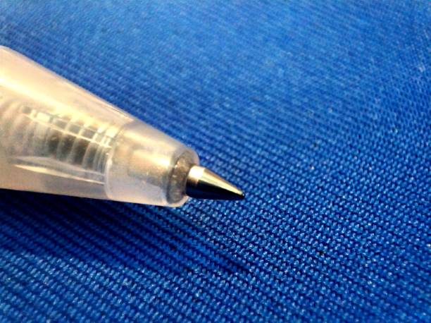 istock Ballpoint pen on blue cloth (macro zoom) 1433327101