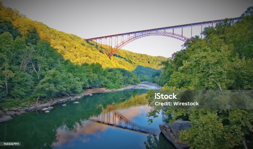 Low angle shot of New River Gorge Bridge over New River Gorge in Victor, West Virginia A low angle shot of New River Gorge Bridge over New River Gorge in Victor, West Virginia West Virginia - US State Stock Photo