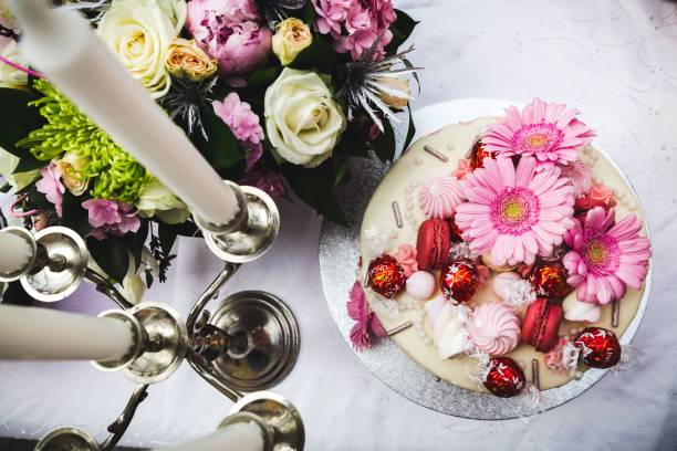 istock Top view of candles, flowers, and sweets on a table 1433330730