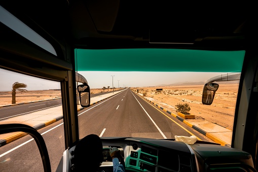 A shot from inside a bus driving on the road in Egypt