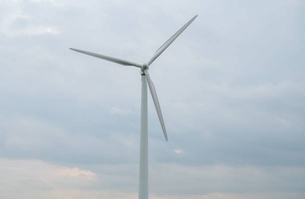istock White wind turbine under the gloomy sky 1433334225