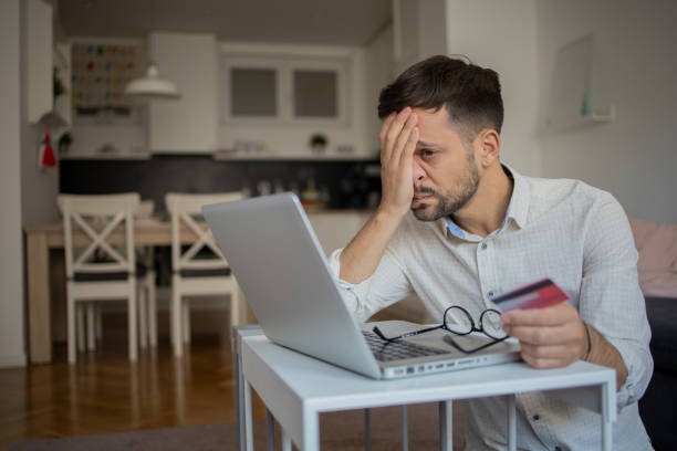 istock Man using her credit card to shop online 1433336232