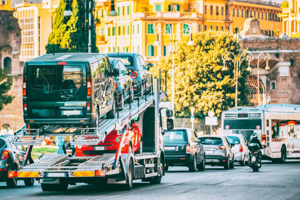vehicles being transported by a truck