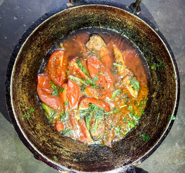 Bengali fish curry in pan. This is popularly known as Chital macher jhol in Bengali language. Clown knife fish. Bengal food or dish. Chitala chitala. Bengali fish curry in pan. This is popularly known as Chital macher jhol in Bengali language. Clown knife fish. Bengal food or dish. Chitala chitala. chitala stock pictures, royalty-free photos & images