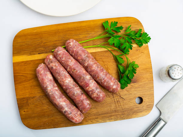istock Raw botifarra from minced pork on wooden surface 1433341210