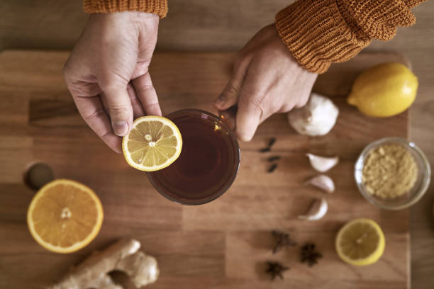 istock From above woman adding lemon to tea 1433342159