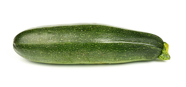 istock Green zucchini on a white background, organic marrow vegetable. 1433342473