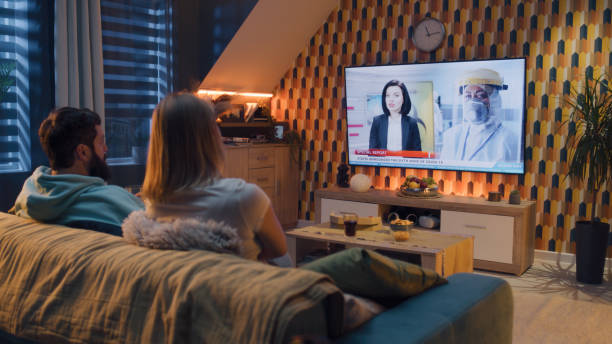 istock Couple watching Covid 19 breaking news 1433343081