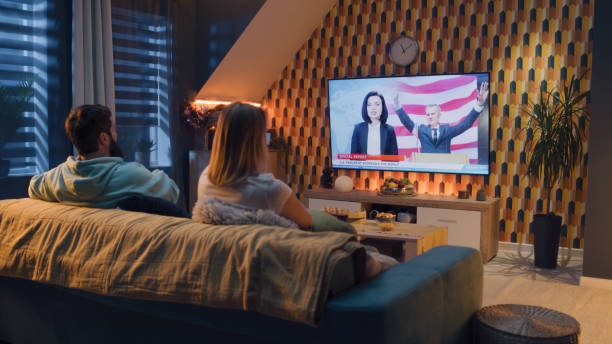 istock Couple watching presidential address on TV 1433343111