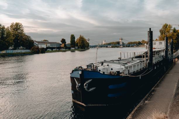istock Beautiful view of a cargo boat docked on a river on a cloudy day 1433344244