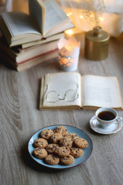 istock Cookies, Tea, Books and Candle 1433345376