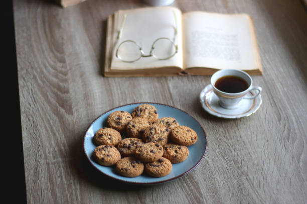 istock Cookies, Tea, Books and Candle 1433345377