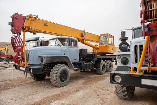 A heavy construction crane parked on the construction site