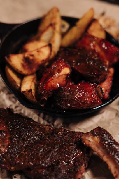 istock Appetizing grilled pork ribs with potatoes 1433346538