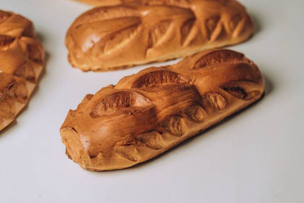 istock Closeup of sweet bread loaves on a white surface 1433346949