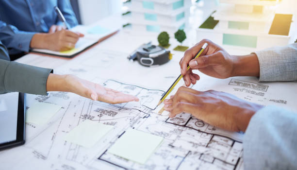 Hands of architecture blueprint design, 3d property construction building and engineering model planning. Creative team collaboration on floor plan sketch, drawing development and industrial project