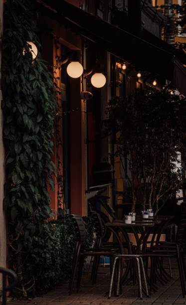 istock Outdoor restaurant table and chair set up at night 1433351365