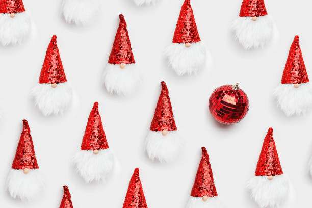istock Christmas composition. Cute dwarfs with white beard and red cap with sequins and mirror ball on white background. Christmas, New Year holidays concept. Flat lay, top view minimal pattern 1433352871
