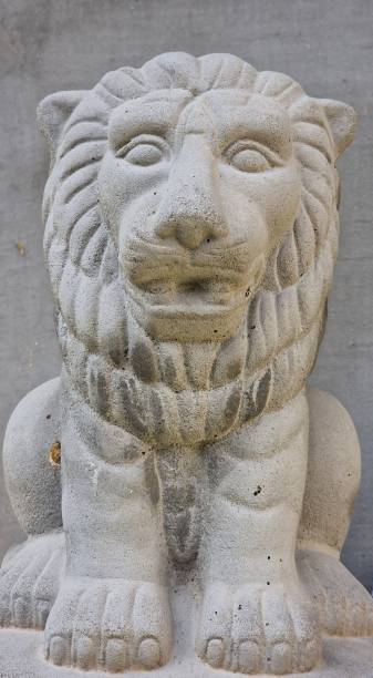istock White lion sculpture near a wall 1433353893
