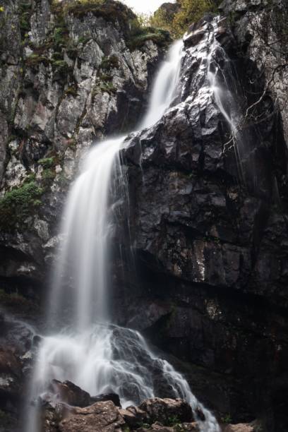 istock Vertical shot of waterfall flowing over the rocks 1433354598