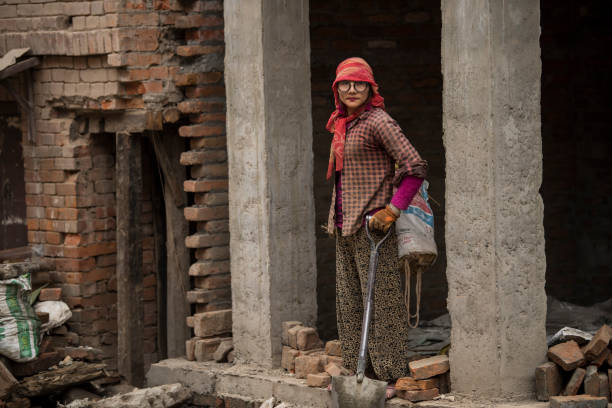 Kathmandu, Nepal- April 20,2022 : Local people of all ages and genders are working to rebuild the ruined old city in a major earthquake in Patan Durbar Square.
