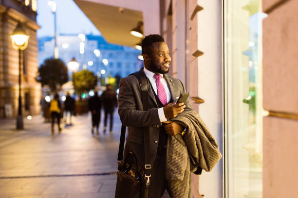 istock Black businessman window shopping after work 1433356402