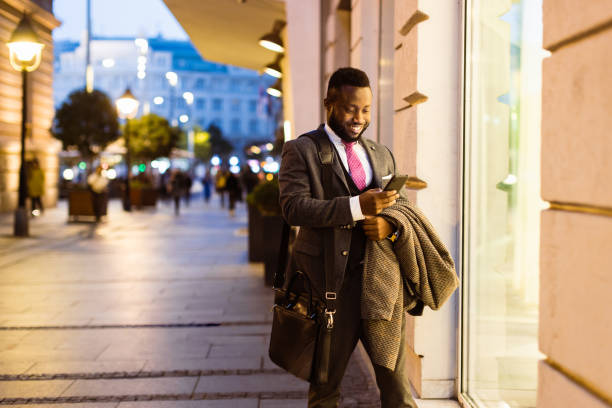 istock Black businessman window shopping after work 1433356436