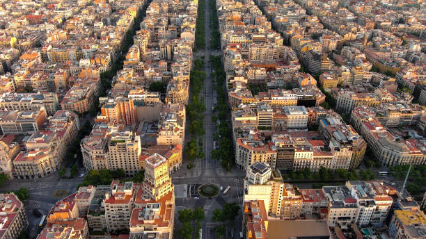 Aerial view of Passeig de Gracia major avenues in Barcelona in summer day at sunrise. Catalonia, Spain This elegant, majestic boulevard was a showcase for Barcelona's bourgeoisie at the turn of the 19th century, and links the Plaça Catalunya with the district of Gràcia, hence its name. avenida diagonal stock pictures, royalty-free photos & images