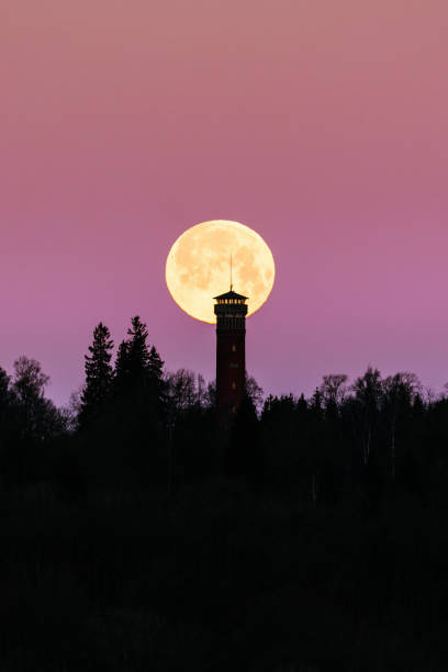 istock Spooky full moon over a tower in silhouette 1433359311