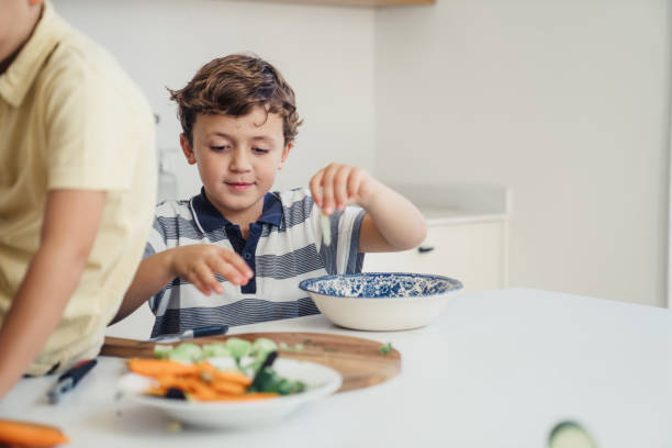 istock Family preparing food in the kitchen 1433360561
