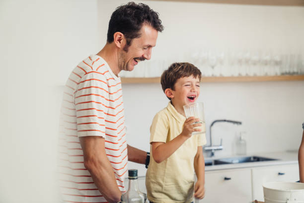 Boy drinking glass of water
