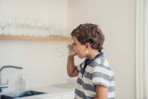 Boy drinking glass of water
