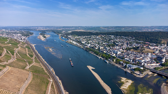 Confluence of Nahe and Rhine River at Bingen, Germany - Visible rocks and sandbars due to extraordinary low water level after a long period of drought in 2022.