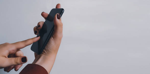 istock Lady holding mobile phone closeup concept image 1433361933