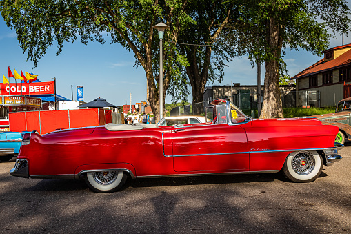 Falcon Heights, MN - June 19, 2022: Low perspective side view of a 1955 Cadillac Series 62 Convertible at a local car show.